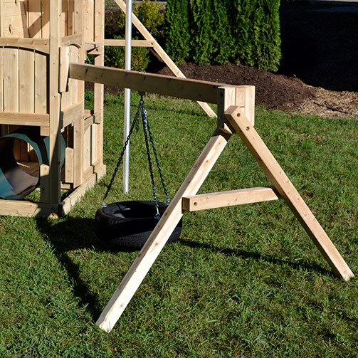 Wooden swing set arm with a 360 degree tire swing.