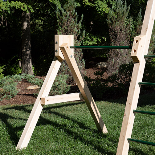 A wooden swing set arm with a steel pipe for turning.