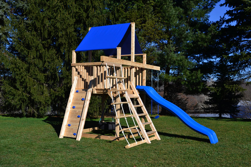 Cedar swing set for small yards with rock wall and rope ladder.