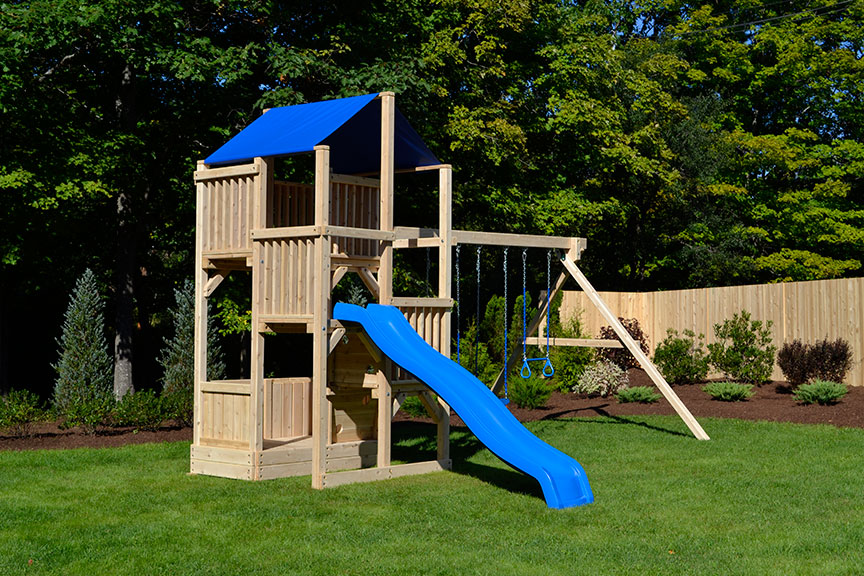 Cedar play set with four levels, wave slide, trapeze and two belt swings.