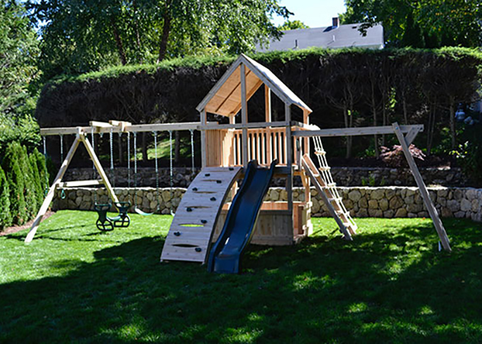 Triumph Play Systems Bailey Deluxe play set with arched rockwall in Belmont, MA