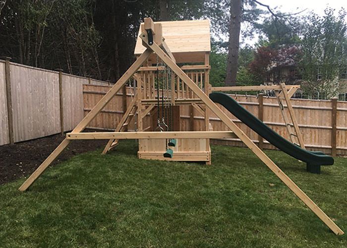 Swing Set with modifications to accommodate slope in Chestnut Hill, MA