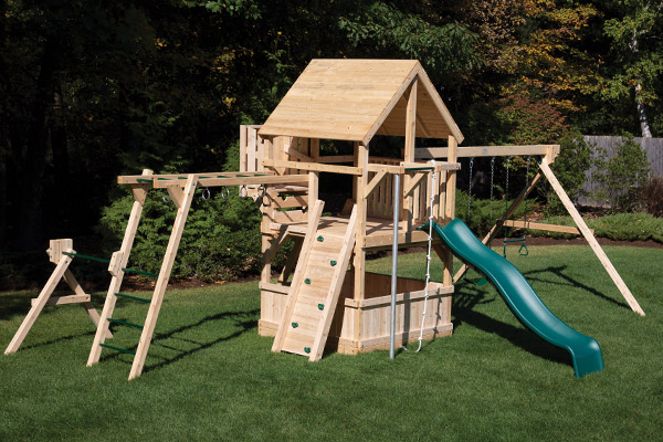 Classic backyard cedar swing set with monkey bars, firepole and climbing rope.