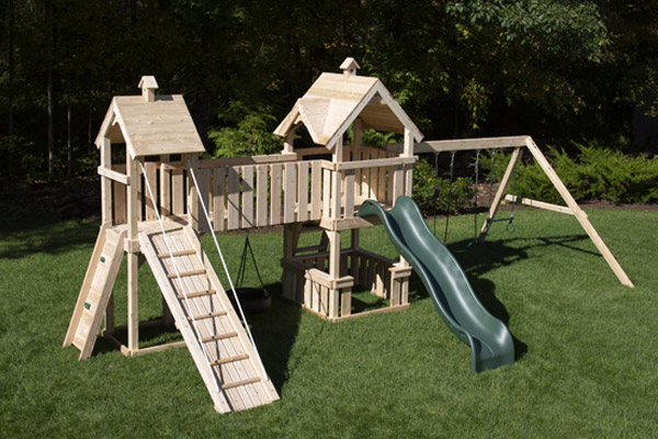 Festival cedar swing set with two play forts, bridge and play set ramp.