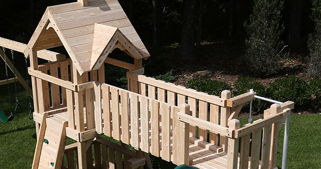 Cluse up of Triumph's Festival 3 cedar swing set kit.