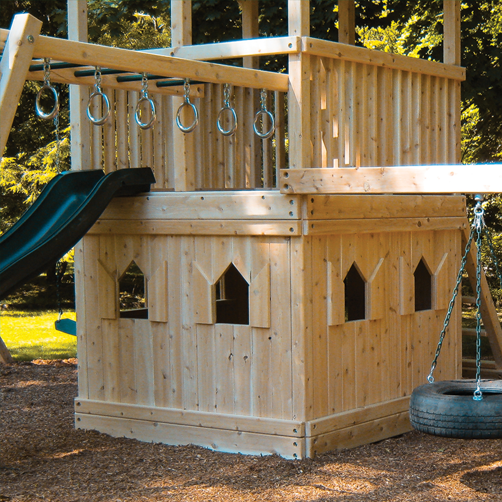 A cedar clubhouse with floors under a swing set fort.