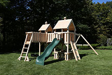 Wooden swing set with Rock wall climbing ladder.