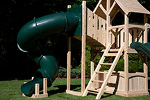 Triumph Play System's Havendale Deluxe cedar swing set with tower and tube slide.