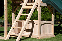 Triumph Play System's Havendale Deluxe cedar swing set with tower and tube slide.