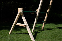 Triumph Play System's havendale loaded cedar swing set with rockwall and slide.