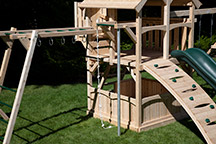 Triumph Play System's Kelton loaded cedar swing set with firepole and climbing rope.