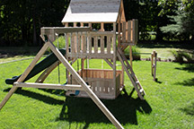 Triumph Play System's Kelton loaded cedar swing set with crow's nest