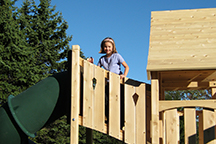 Triumph Play System's Kelton Space Saver Deluxe with girl on tower.