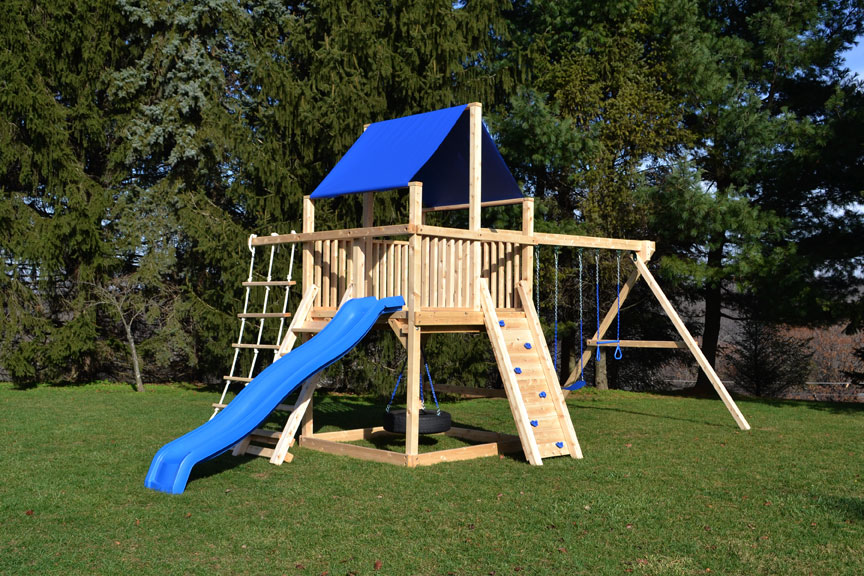 Cedar swing sets with rock wall and rope ladder.