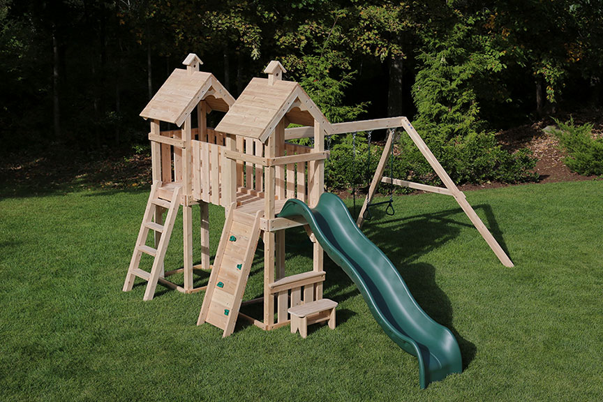 Cedar swing set with short bridge and two towers.