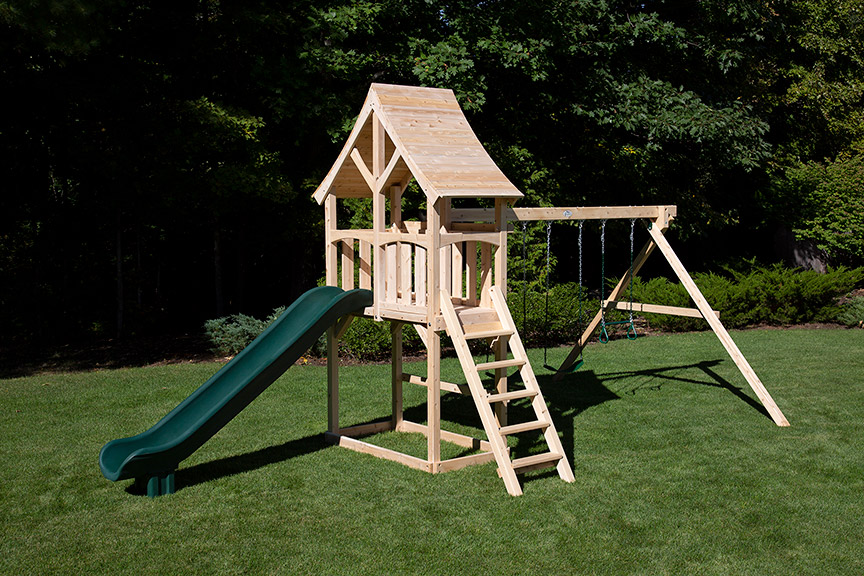 Cedar swing set with arched wood roof, two swings and a green scooop slide.