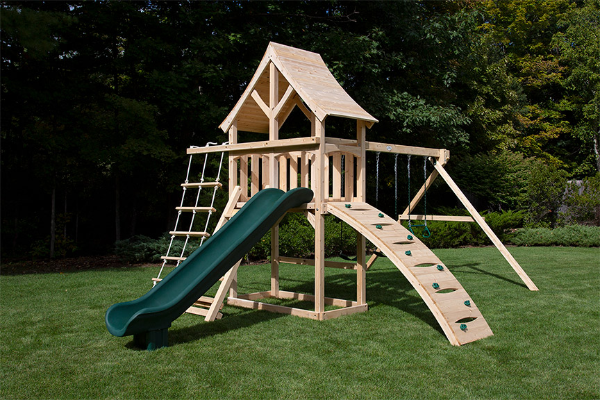 Cedar swing set with arched wood roof, rock wall and rope ladder.
