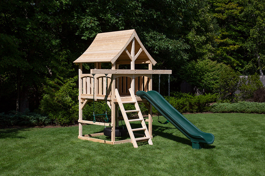 Cedar swing set for small yards with arched wood roof and green scoop slide.