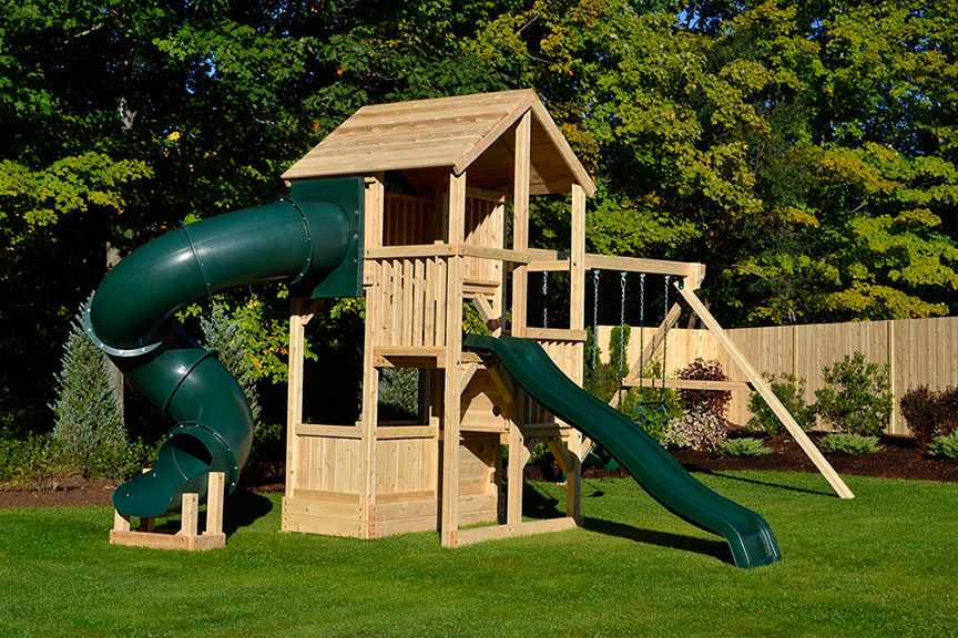 Wooden play set with four levels, tube slide and wooden roof.