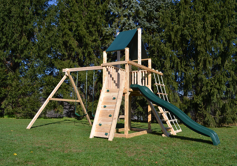 Triumph Play System's Dunmore wooden swing set with rockwall and rope ladder.