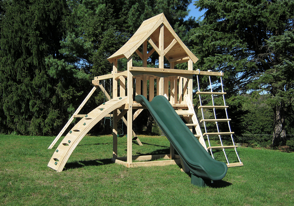 Triumph Play System's havendale climber cedar swing set with rockwall and slide.