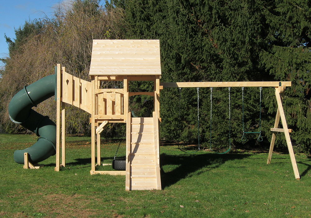Triumph Play System's kelton deluxe cedar swing set with ramp and tube slide.