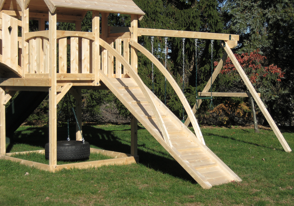 Triumph Play System's kelton deluxe cedar swing set with ramp and tube slide.