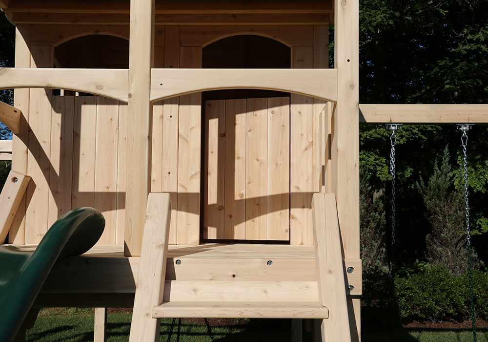Triumph Play System's Nottingham Climber cedar swing set with wood roof.