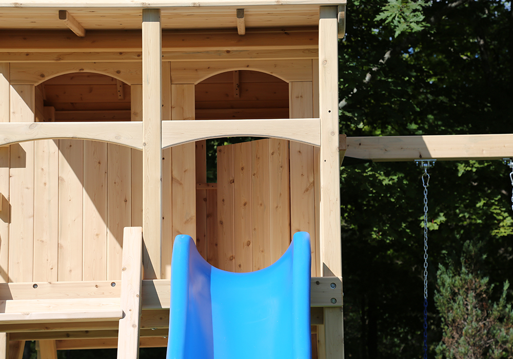 Triumph Play System's Nottingham Deluxe cedar swing set with wood roof.